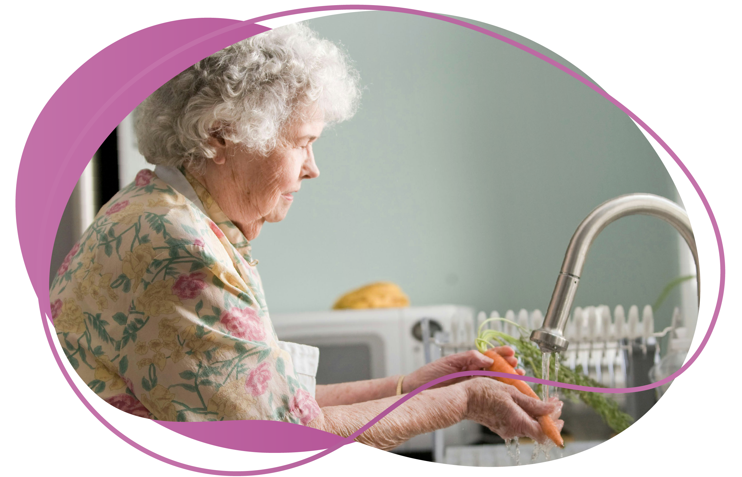 Elderly woman at kitchen sink